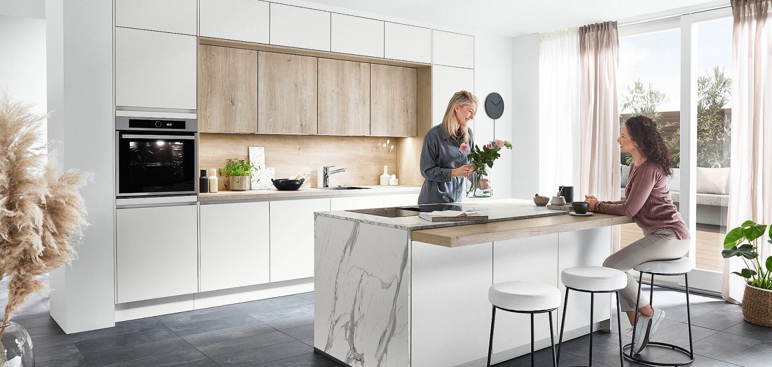 Wood kitchen cabinetry with a large island