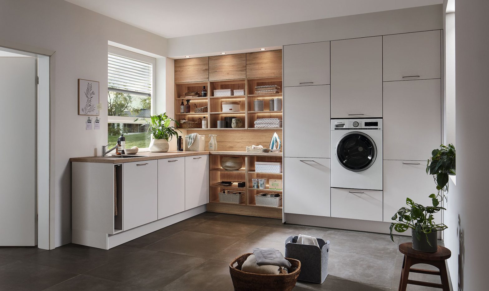 Luxury laundry area with European-style